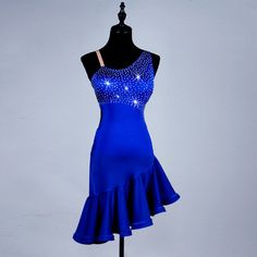 a blue dress with sequins on the top and bottom, is displayed on a mannequin