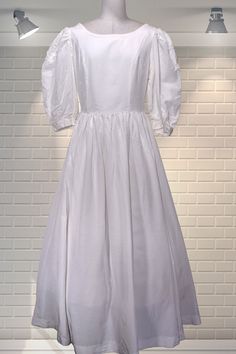 "Elegant white fit and flare wedding dress - Laura Ashley, Made in GB label. Fitted bodice, huge puff sleeves, one pocket, long sweeping skirt, wrap over back.  Demure, simple and beautiful. Fabric is a cotton/viscose mix and medium weight.   In good cared for condition.  There is a slub on the skirt which has been overstitched to prevent it from becoming loose.  See photo. It's a size 12 on the label but measures like a modern day UK 8 Chest:  up to 34\" Waist:  26\" Hips:  Free Shoulder to hem:  54\" Please ask if you have any questions  :)  Please note:  this is a used item, not new and not pristine.  My items have been in storage and may require laundering.  If there is a problem with your order please contact me straight away - I always work with my customers to try and resolve any is White Fitted A-line Ball Gown, White A-line Wedding Ball Gown, White A-line Gown For Debutante Ball, Classic A-line Vintage Wedding Dress, Fitted Puff Sleeve Dress For Debutante Ball, White A-line Ball Gown For Wedding, A-line Wedding Dress With Fitted Bodice For Formal Event, A-line Wedding Dress With Fitted Bodice For Debutante Ball, White A-line Bride Dress