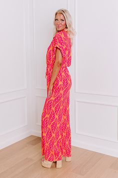 - Stroll into style with this trendy jumpsuit, where laid-back vibes meet botanical beauty. Its relaxed silhouette, adorned with a charming abstract leaf print, is complemented by a collared neckline and a drawstring cinched waistline, ensuring both comfort and flair. Effortlessly chic, it's your go-to for relaxed outings or leisurely escapes, promising a blend of ease and sophistication that's as laid-back as it is refined. - Unlined material with an abstract leaf print featuring pink and orang Pink Games, Short One Piece, Trendy Jumpsuit, Abstract Leaf, Orange Hues, Botanical Beauty, Leopard Dress, Black Dresses Casual, Little White Dresses