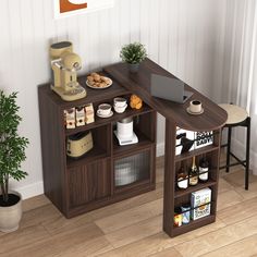 a computer desk with an open bookcase and coffee maker on the top, next to a potted plant