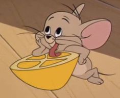 a cartoon mouse eating out of a yellow bowl