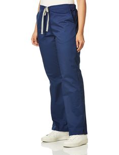 PRICES MAY VARY. Women's flare leg pant. Women's fit with flare leg opening Back elastic waist with full adjustable drawstring Front rise sits slightly below natural waist and the back ack rise being a bit higher for coverage Two roomy slash pockets and two back pockets One utility belt loop Full Length Drawstring Pants, Leg Scrub, Safety Clothing, Utility Belt, Flare Leg Pants, Scrub Pants, Body Measurements, Scrubs, Top Styles