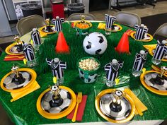 a soccer themed table set up for a party