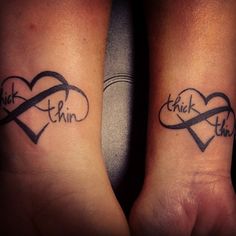 two people with matching tattoos on their arms