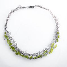 Elegant Green Necklace With Sterling Silver Clasp, Green Peridot Wire Wrapped Jewelry, Handmade Green Peridot Jewelry, Elegant Green Wire Wrapped Necklace, Handmade Green Peridot Necklaces, Handmade Lime Green Peridot Jewelry, Elegant Hand Forged Green Jewelry, Elegant Green Hand-forged Jewelry, Handmade Silver Peridot Necklaces