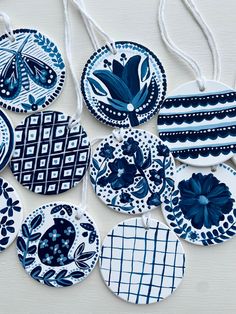 blue and white ceramic ornaments hanging from strings