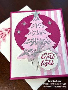 a card with a christmas tree on it, and the words merry baby light written in silver