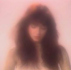 a blurry photo of a woman with long hair