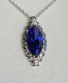 "Stunning Tanzanite Color Cubic Zirconia Marquise Cut, With Sparkle Galore, See Video! These Tanzanite CZs Have Amazing Color! 925 Sterling Silver Curly-Q Pendant With Accent Cubic Zirconia, 20\" Sterling Silver Chain. Chain Length Options Available By Messaging Seller At Time Of Purchase. Gift Box Included." Marquise Necklace, Favorite Rings, Marquise Cut, Chain Lengths, Chain Length, Sterling Silver Chains, Silver Chain, Necklace Lengths, Cubic Zirconia