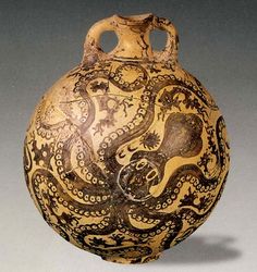 an old vase with intricate designs on the outside and inside, against a red background