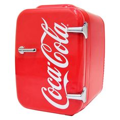 an old fashioned coca - cola machine is red and white with the word coke on it