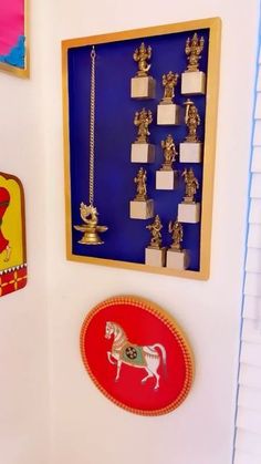 there are many items on the wall in this room that is decorated with gold and red