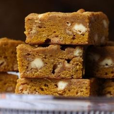 a stack of pumpkin bars sitting on top of a glass plate