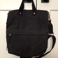 This Black Canvas Bag Is Great For Your Everyday Use! Short Handle Has 4” Handle Drop Plus A 1.3/4” Wide, Adjustable, Removable Shoulder/Crossbody Strap. The Zippered Exterior Pocket Has 2 Separate Compartments. Interior Has A Zip Pocket. Bag Has Brass Hardware. Top Has Magnetic Closure. Black Canvas Bag, Pocket Bag, Black Canvas, Brass Hardware, Crossbody Strap, Magnetic Closure, Canvas Bag, Zip Pockets, Bag Lady