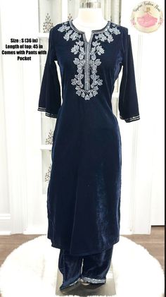 Product Name: Beautiful Party Wear Velvet Kurti Suit Set (2-Piece Set with Embroidery) Colors: dark green and Dark Navy blue Description: Elevate your party style with our exquisite Party Wear Velvet Kurti Suit Set. This stunning ensemble includes a velvet kurti top and matching velvet pants adorned with intricate embroidery. The top features measure 45 inches in length, offering a graceful and elegant look. The soft and luxurious velvet fabric provides comfort and sophistication, making it perf Elegant Embroidered Pant Set For Navratri, Fitted Velvet Bollywood Dress, Fitted Velvet Dress With Resham Embroidery, Festive Blue Velvet Sets, Fitted Velvet Traditional Wear With Dabka Detailing, Fitted Velvet Traditional Wear With Dabka, Party Velvet Embroidered Kurta, Velvet Long Sleeve Kurta For Party, Fitted Embroidered Velvet Kurta