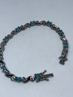 This Blue Topaz bracelet is very lively and bright. The stones are deep colors and well matched. The sterling silver is very solid with antiqued rhodium finish 7.5 inches My jeweler can shorten this for a $20 fee All jewelry is shipped in a nice gift box. Check out our over a THOUSAND great reviews Engraving is $4 per letter and is not always perfect depending on the piece. It can take a few days if the jeweler is busy. This is payable to Paypal Judithsltd@gmail.com Blue Topaz Bracelet, Deep Colors, Tennis Bracelet, Chain Link Bracelet, Blue Topaz, Arm Band, Tennis, Topaz, Silver Bracelet