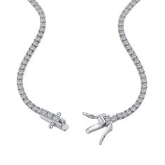 The epitome of understated elegance. A row of 2mm round cut premium zirconia stones meticulously set on a pure sterling silver chain using a 4 prong setting featuring a double clasp push safety closure. A classic design and quality craftsmanship made to surpass the trends and test of time. Tennis Necklace, Understated Elegance, Earrings Collection, Ring Collections, Real Diamonds, Sterling Silver Chain, Ring Bracelet, Eternity Ring, Ring Necklace