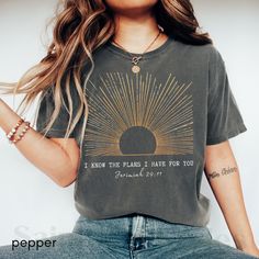 Shine bright with our Boho Christian Shirt! This sunshine T-shirt is a daily prayer reminder and makes a perfect gift. Featuring Jesus Christ designs, this Christian merch combines faith streetwear with vintage worship vibes. Wear your love for Jesus and conversation starter Bible verse T-shirt for inspirational style. **Note: FOR A RELAXED FIT, CHOOSE YOUR GO-TO SIZE. TO ACHIEVE AN OVERSIZED, LOOSE FIT, WE RECOMMEND GOING UP AT LEAST 1-2 SIZES. MODELS IN PHOTOS ARE WEARING 1-2 SIZES LARGER THAN Inspirational Graphic Print T-shirt For Everyday, Inspirational Letter Print Tops For Everyday, Inspirational Graphic Print Tops For Everyday, Inspirational Screen Print Crew Neck Top, Inspirational Everyday T-shirt With Graphic Print, Inspirational Crew Neck Soft-washed T-shirt, Inspirational Soft-washed Crew Neck T-shirt, Inspirational Short Sleeve Tops For Everyday, Inspirational Short Sleeve Everyday Tops