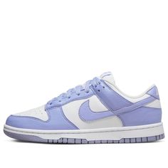 Take a step back in time while freeing the environment from some of its human-caused burden with the Nike Dunk Low Next Nature Lilac Women. Crafted with 20% recycled materials, these eye-catching shoes provide an inspiring take on retro style. The upper is designed using white leather and punctuated with perforated toe box for added breathability. Violet hues appear throughout, tinting the overlays and laces as well as adding a subtly branded touch via a purple Nike label on the tongue. To complete the look, the heel has an embroidered white Nike logo and volt insole sets off a black pinwheel against the white rubber midsole. This eco-friendly masterpiece comes together with a stunning purple Grind outsole—an inimitable combination of athletic style and sustainable design. With fashion tre Nike Dunk Low Next Nature, Preppy Shoes, Purple Nikes, Cute Nike Shoes, Nike Dunk High, Cute Nikes, July 2022, Swag Shoes, A Bathing Ape