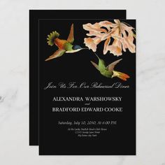 a black and white wedding card with two hummings flying over the top of flowers