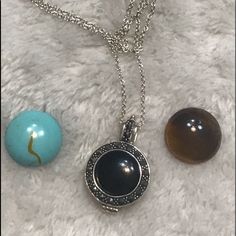 Brand New Never Worn Sterling Silver Necklace With A Round Charm That Has Marcasite Stones Set Around The Circle. It Comes With Turquoise Onyx Tigers Eye Stones That Are Interchangeable Inside The Charm. Elegant Silver Necklace With Interchangeable Details, Silver Interchangeable Jewelry As Gift, Silver Interchangeable Jewelry Gift, Silver Interchangeable Jewelry For Gifts, Elegant Black Medallion Locket Necklace, Black Round Locket Necklace, Elegant Nickel-free Round Pendant Locket Necklace, Elegant Black Pendant Locket Necklace, Silver Charm Necklace With Round Natural Stone Pendant