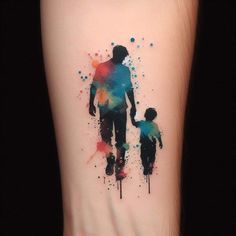 a watercolor tattoo with the silhouette of a man and child