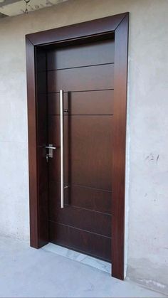 the door is made of wood and has a metal handle on it's side