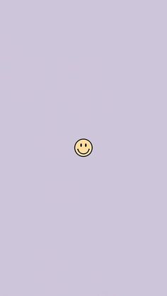 a yellow smiley face on a purple background