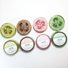 six different types of soaps on a white surface, each with their own logo