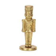 a gold colored figurine is shown on a white background