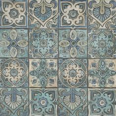 an artistic tile design with blue and brown colors