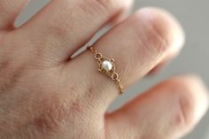 This chain with is so lovely. Easy to wear, Dainty and lightweight. Perfect for everyday wear. All jump rings are bonded closed making this ring more sturdy. Pearl measures 3mm. Rope chain measures 1mm. Handcrafted out of solid 14K gold. This ring runs small, it is recommended to order half a size larger than you normally wear. Want a different gemstone? Message Liesel Love- many are available. Processing times - Current processing time is 1 - 5 business days. Each Item is handmade to order with Gold Ring Chain, Pearl Rings, Small Pearl Ring, Gold Gold, Jewelry Lookbook, Pearl Chain, Chain Ring