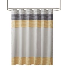 a white shower curtain with yellow and grey stripes on the bottom, hanging from a metal rod