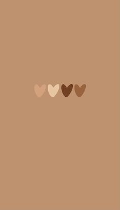 three hearts on a brown background