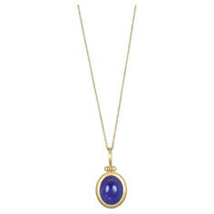 Faye Kim's 18 Karat Gold Tanzanite Cabachon Hinged Ball Pendant, with its striking blue hue, is sure to make a design statement! This unique, one of a kind piece is finished with Faye's signature clean bezel and hinged bail. Paired with 18 Karat Gold 1.1mm Cable Chain, 18/20", adjustable. Tanzanite 6.62 cts Pendant Length .7" Width .5" Depth .33" 18 Karat Gold 1.1mm Cable Chain, 18/20" adjustable, can be sold separately and is available in other custom lengths and styles: Pendant $2695 18 Karat Gold 1.1 mm Cable Chain, 18/20" adjustable $585 Please inquire for more info. Made in the USA. Elegant Blue Cabochon Necklaces, Formal Blue Cabochon Necklace, Elegant Blue Oval Cabochon Necklace, Elegant Blue Cabochon Necklace, Yellow Gold Tanzanite Oval Necklace, Gold Tanzanite Jewelry With Faceted Design, Luxury Gold Tanzanite Necklace, Gold Tanzanite Pendant Jewelry, Tanzanite Gemstone Pendant Necklace