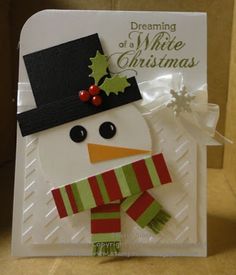 a card with a snowman wearing a hat and scarf