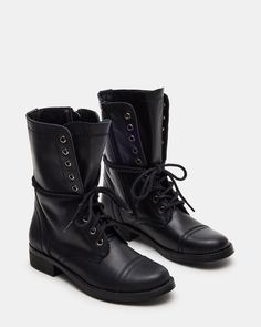 The TROOPA3.0 boot features a combat moto design, adding a stylish edge to your look. These booties are built to last and provide long-lasting comfort. Perfect for those who want to make a statement while still prioritizing practicality. 1 inch heel height 10.5 inch shaft circumference 7.75 inch shaft height Leather upper material Synthetic lining Synthetic sock Synthetic sole Imported Trooper Boots, Kitten Heel Slingbacks, Women's Booties, Madden Boots, Steve Madden Boots, Leather Moto, Sneaker Heels, Heeled Loafers, Womens Boots Ankle