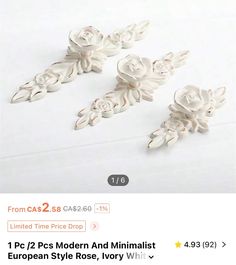 some white flowers are on the table and one is for $ 2 99 or more