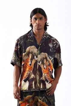 Fabric - Tencel SatinPrint / Emblishment - Digital PrintHalf-sleeve Cuban Collar shirt featuring a hunting sequence between an elephant and a tiger.Shirts (Inches) XS S M L XL XXL Chest 38 40 42 44 46 48 Shoulder 17.5 18.5 19.5 20.5 21 21.5 Length 26 27 27.5 28 29 30.5 Tiger Shirts, Cuban Collar Shirt, A Tiger, An Elephant, Collar Shirt, Collar Shirts, Hunting, Elephant, Collar