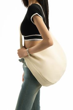 Discover effortless style with our versatile Canvas Crossbody Bag, designed for the modern trendsetter seeking both form and function.
Made from durable canvas, this bag showcases a minimalist solid color and a simplistic bucket shape. Its spacious interior, complemented by a soft canvas lining, provides ample space for your essentials. The open top grants unobstructed access, while the single, sturdy strap offers comfortable one-shoulder or crossbody wear. 
Dress it up or down; this crossbody i Canvas Sling Bag, Canvas Crossbody Bag, Urban Wear, Open Top, Urban Fashion, Cotton Weaving, Trend Setter, Effortless Style, Clothing Items