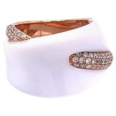 A smooth piece of white onyx sparkles on top of this modern styled ring. It is accented with 0.57 carats of round brilliant cut diamonds set in 18k rose gold. A fashionable piece that can compliment any outfit, day or night. Ring Size 5.75 Fancy Pink Diamond Ring, Diamond Gold Ring, Pink Diamond Ring, White Onyx, Diamond Gold, Onyx Ring, Gold Diamond Rings, Pink Diamond, High Jewelry