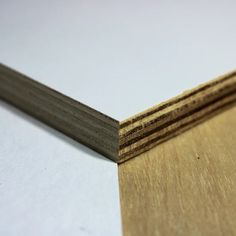 several pieces of wood are stacked on top of each other in this close up photo