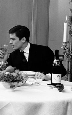 a man and woman sitting at a dinner table