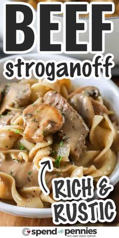 beef stroganoni with rich and rustic pasta in a white bowl on a wooden table