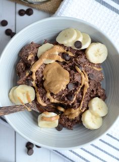 a bowl filled with chocolate pudding and bananas