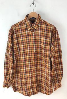 "-Description- >men orange, yellow, green, red plaid shirt >button front >collared >open pocket on the front >size medium >perfect plaid for the fall/autumn! >condition: great >color(s): orange, yellow, green, red, white >fabric(s): cotton >brand: john ashford >care: machine wash -Measurements- >size: medium ✩ all measurements are taken with the item laying flat & some sizes are estimates so please check measurements ✩ chest:44\" / 112cm length: 30\" / 76c Plaid Shirt With Spread Collar And Placket, Plaid Cotton Flannel Shirt With Casual Collar, Plaid Collared Shirt With Placket, Collared Plaid Shirt With Placket, Fall Orange Shirt With Button Closure, Orange Fall Shirt With Button Closure, Plaid Collared Shirt, Casual Orange Shirt With Spread Collar, Fall Multicolor Collared Shirt