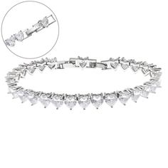 Introducing the Solstress "Diamond Heart Tennis Bracelet," a stunning piece that radiates elegance and romance. This bracelet showcases premium heart-shaped cubic zirconia stones, each sparkling with diamond-like brilliance. The sleek design and perfectly placed hearts create a timeless look that’s both sophisticated and sweet. Whether you're gifting it to someone special or treating yourself, the Diamond Heart Tennis Bracelet is the perfect accessory to add a touch of luxury and love to any outfit. Add the Solstress "Diamond Heart Tennis Necklace” to complete the set! Silver plated Water and tarnish-resistant Adjustable: 7in -7.5 in Luxury Formal Heart Jubilee Bracelet, Luxury Heart Bracelet With Diamond Accents For Wedding, Luxury Brilliant Cut Heart Bracelet For Formal Occasions, Luxury Heart Cut Heart Bracelet For Wedding, Affordable Silver Heart Bracelet For Wedding, Luxury Diamond Accented Heart Bracelet For Wedding, Luxury Heart Cut Bracelet For Wedding, Luxury Women's Heart Bracelet With Diamond Accents, Luxury Heart Bracelet With Diamond Accents For Anniversary