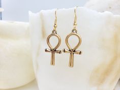 The Egyptian Ankh symbolizes life, protection & eternity. Its power was believed to protect the dead and ensure eternal life. Wear a piece of Ankh jewelry for protection, a reminder of the past, or just as an accessory. Materials: 1” pewter charm with gold plated ear wire Made in USA Egyptian Writing, Ankh Jewelry, Egyptian Ankh, Eternal Life, Colourful Necklace, Pendant Rings, Large Earrings, Ring Collections, Ancient Egyptian