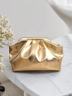 Let's take a look at the features of The Metallic Gold Clutch hand-crafted for your special invitation.  Crafted with metallic leather look fabric and satin lining. The Gold Clutch will come with a long detachable bag handle that you can use as a cross-body bag if you want.  See more of our and glossy clutchs here: https://www.etsy.com/shop/NaifCreativeStudio?ref=seller-platform-mcnav§ion_id=48788343 See the rest of our store here: https://www.etsy.com/shop/NaifCreativeStudio Designed for specia Event Evening Pouch Bag With Removable Pouch, Evening Bag For Events With Removable Pouch, Event Evening Bag With Removable Pouch, Gold Clutch Coin Purse For Wedding, Gold Handheld Evening Bag With Removable Pouch, Gold Coin Purse Clutch For Wedding, Gold Clutch With Removable Pouch As Gift, Elegant Formal Cosmetic Bag With Removable Pouch, Elegant Cosmetic Bag With Removable Pouch As Gift