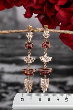 Wedding burgundy earrings Burgundy stud earrings bride Vintage earrings Crystal earrings Boho bridal earrings Wedding bridal earrings 1920s Cute earrings for your special occasion with crystal and small cubic zirconia on the hook and inside the leaves for sparkle. Be irresistible on your special occasion. Metal: Brass, Gold If you want to change the colors of the pendant or change the design to your liking, just contact me and together we will create a masterpiece WITH YOUR HANDS. Follow the link below to see more jewelry for your special day. https://niceolhajewelry.etsy.com ◆ Delivery ◆America takes 5-9 days after dispatch. ◆ Sweden 9-10 days after dispatch. ◆All items on my website are in stock. Order processing takes 1-3 days from the date of order. ◆Delivery within Germany 3-4 days af Autumn Color Season, Burgundy Earrings, Wedding Burgundy, Bride Vintage, Earrings Bride, Be Irresistible, Bracelet Tennis, Deco Earrings, Bride Earrings